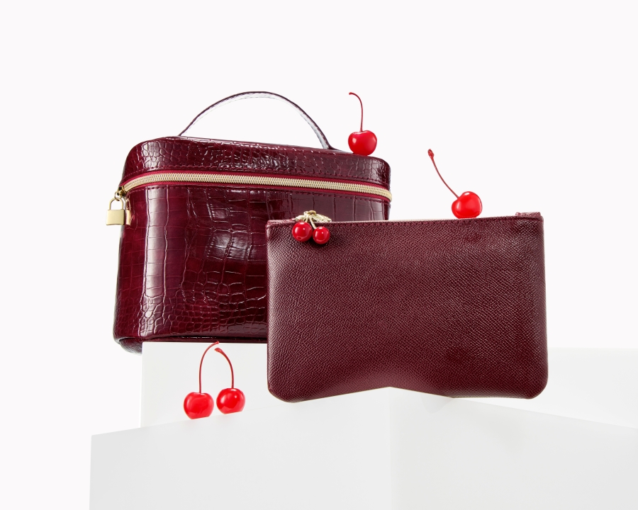 Ipsy bag and wallet with cherries in maroon color.